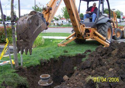 Valley City Plumbing in Modesto uses a backhoe to dig outdoor plumbing drainage and sewer pipes
