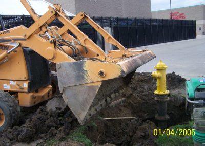 Bulldozer use by Valley City Plumbing to dig dirt for pipe repair