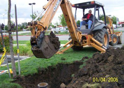 Valley City Plumbing in Modesto, Ca uses a backhoe to excavate pipes
