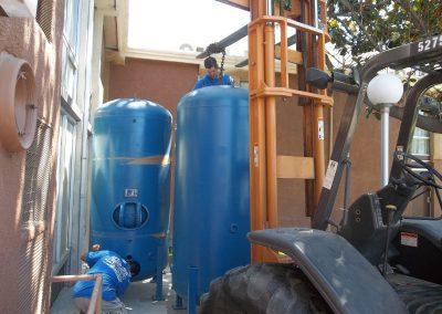 Installation of large water tanks for commercial building by Valley City Plumbing in Modesto, Ca