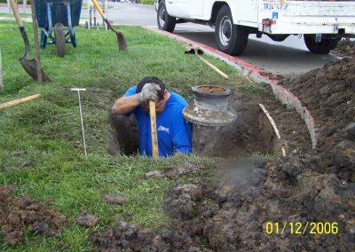 Plumber fixing pipes